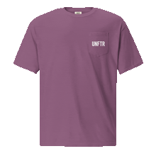 Load image into Gallery viewer, Berry colored t shirt with pocket. The pocket says UNFTR in white and the back has has a photo of Milton Friedman with a red circle strikethrough
