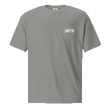 Load image into Gallery viewer, Grey colored t shirt with pocket. The pocket says UNFTR in white and the back has has a photo of Milton Friedman with a red circle strikethrough
