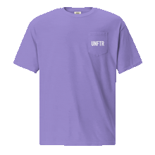 Load image into Gallery viewer, Violet colored t shirt with pocket. The pocket says UNFTR in white and the back has has a photo of Milton Friedman with a red circle strikethrough