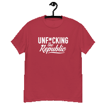 Load image into Gallery viewer, Cardinal colored classic tee shirt that says Unf*cking The Republic in white on the front and F*ck Milton Friedman in white on the back