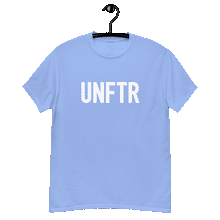 Load image into Gallery viewer, Carolina blue classic tee shirt that says UNFTR in white on the front and F*ck Milton Friedman in white on the back