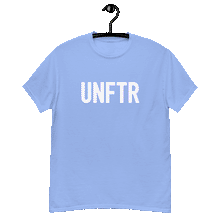 Load image into Gallery viewer, Carolina blue colored classic tee shirt that says UNFTR in white on the front and Meeting People Where They Are in white on the back