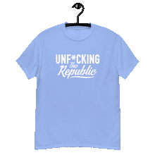 Load image into Gallery viewer, Carolina blue colored classic tee shirt that says Unf*cking The Republic in white on the front and Meeting People Where They Are in white on the back