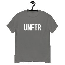 Load image into Gallery viewer, Charcoal gray classic tee shirt that says UNFTR in white on the front and F*ck Milton Friedman in white on the back