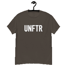 Load image into Gallery viewer, Chocolate colored classic tee shirt that says UNFTR in white on the front and F*ck Milton Friedman in white on the back