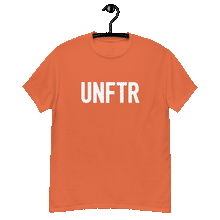 Load image into Gallery viewer, Orange classic tee shirt that says UNFTR in white on the front and Meeting People Where They Are in white on the back