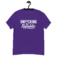 Load image into Gallery viewer, Purple classic tee shirt that says Unf*cking The Republic in white on the front and F*ck Milton Friedman in white on the back