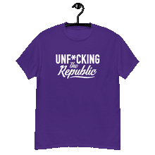 Load image into Gallery viewer, Purple classic tee shirt that says Unf*cking The Republic in white on the front and Meeting People Where They Are in white on the back