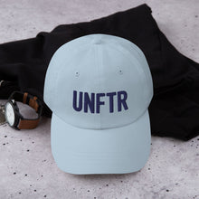 Load image into Gallery viewer, Light blue dad hat with navy embroidered UNFTR logo