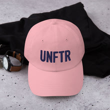 Load image into Gallery viewer, Light pink dad hat with navy embroidered UNFTR logo