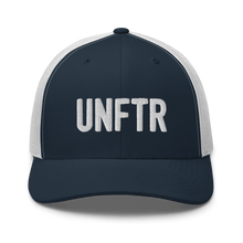 Load image into Gallery viewer, Navy trucker hat with white panels and white embroidery that says UNFTR.