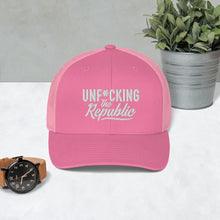 Load image into Gallery viewer, Pink trucker hat with pink side panels with white Unf*cking The Republic logo embroidered on the front