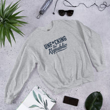 Load image into Gallery viewer, Light heather gray crew neck with navy logo that say Unf*cking The Republic.
