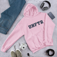 Load image into Gallery viewer, Light pink hoodie with navy block letters that say UNFTR.