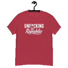 Load image into Gallery viewer, Cardinal colored classic tee shirt that says Unf*cking The Republic in white on the front and F*ck Milton Friedman in white on the back
