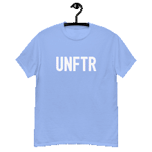 Load image into Gallery viewer, Carolina blue classic tee shirt that says UNFTR in white on the front and F*ck Milton Friedman in white on the back
