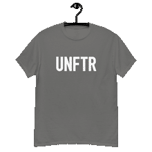 Load image into Gallery viewer, Charcoal gray classic tee shirt that says UNFTR in white on the front and F*ck Milton Friedman in white on the back

