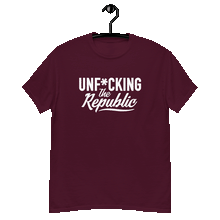 Load image into Gallery viewer, Maroon classic tee shirt that says Unf*cking The Republic in white on the front and F*ck Milton Friedman in white on the back
