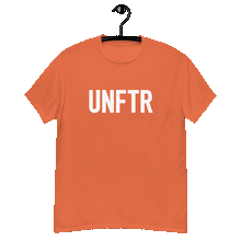 Load image into Gallery viewer, Orange classic tee shirt that says UNFTR in white on the front and Meeting People Where They Are in white on the back
