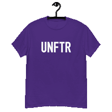 Load image into Gallery viewer, Purple classic tee shirt that says UNFTR in white on the front and F*ck Milton Friedman in white on the back
