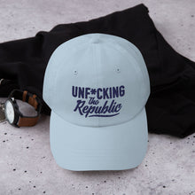 Load image into Gallery viewer, Light blue dad hat with navy embroidered Unf*cking The Republic logo
