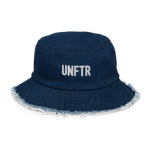 Load image into Gallery viewer, Dark denim bucket hat with white embroidered logo that says UNFTR
