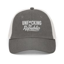 Load image into Gallery viewer, Grey and white trucker hat with white embroidered logo that says &#39;Unf*cking The Republic.&#39;
