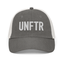 Load image into Gallery viewer, Grey and white trucker hat with white embroidered logo that says &#39;UNFTR.&#39;

