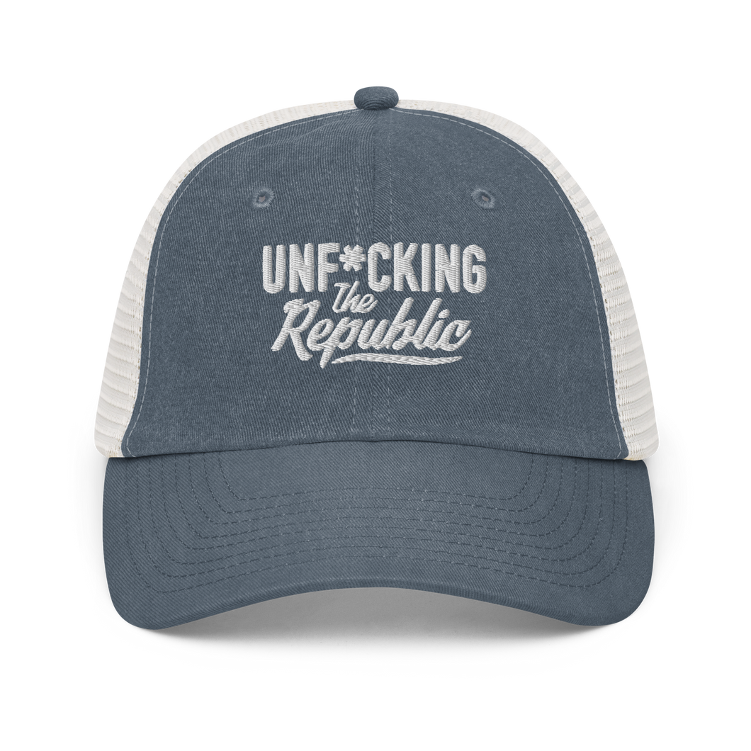 Blue and white trucker hat with white embroidered logo that says 'Unf*cking The Republic.'