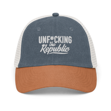 Load image into Gallery viewer, Blue, organge and white trucker hat with white embroidered logo that says &#39;Unf*cking The Republic.&#39;
