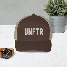 Load image into Gallery viewer, Brown trucker hat with khaki side panels with white UNFTR logo embroidered on the front

