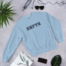 Load image into Gallery viewer, Light blue crew neck with navy block letters that say UNFTR.
