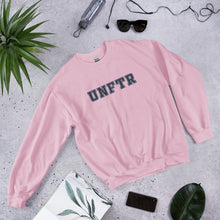 Load image into Gallery viewer, Light pink crew neck with navy block letters that say UNFTR.
