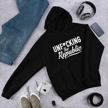 Load image into Gallery viewer, Black hoodie with white logo that say Unf*cking The Republic.
