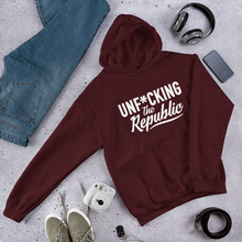 Load image into Gallery viewer, Maroon hoodie with white logo that say Unf*cking The Republic.
