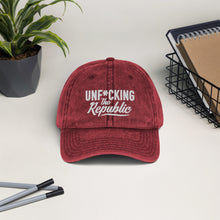 Load image into Gallery viewer, Maroon vintage wash dad cap with white Unf*cking The Republic logo embroidered on the front.
